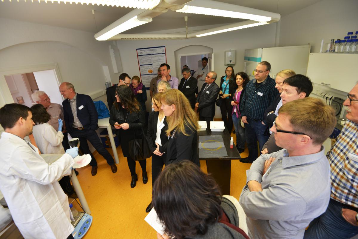 A group of participants of the FDSD meeting 2016 in conversation with QuoData scientists